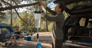 family camping water filter hanging gravity system at campsite