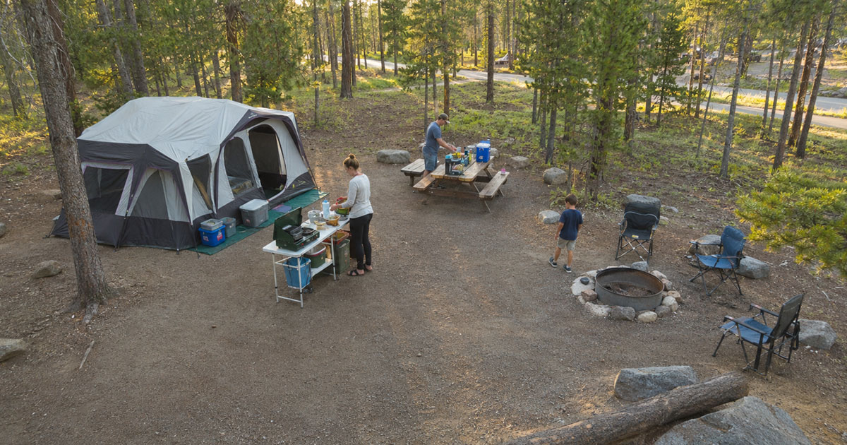 organized family campsite layout with tent and kitchen zones