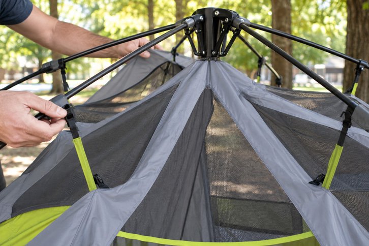 core 9 person instant tent review - steel telescoping pole hub on Core 9-Person Instant Cabin Tent during setup