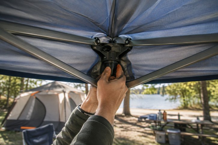 Close-up of a center-push canopy frame locking into place - Best Pop-Up Canopies for Campsite Shade & Rain Cover