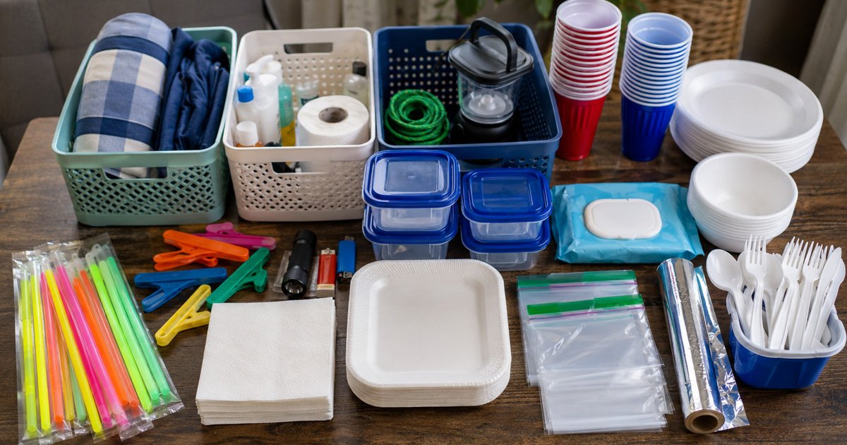 dollar store camping hacks haul with bins, glow sticks, and disposable supplies