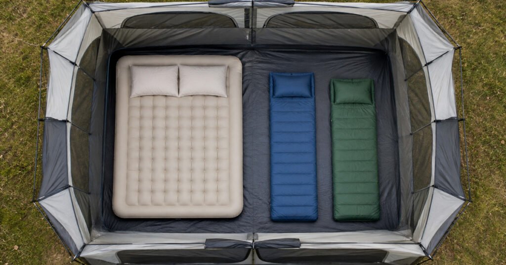 tent size guide diagram showing a queen air mattress and two kids' sleeping pads inside a 6-person tent